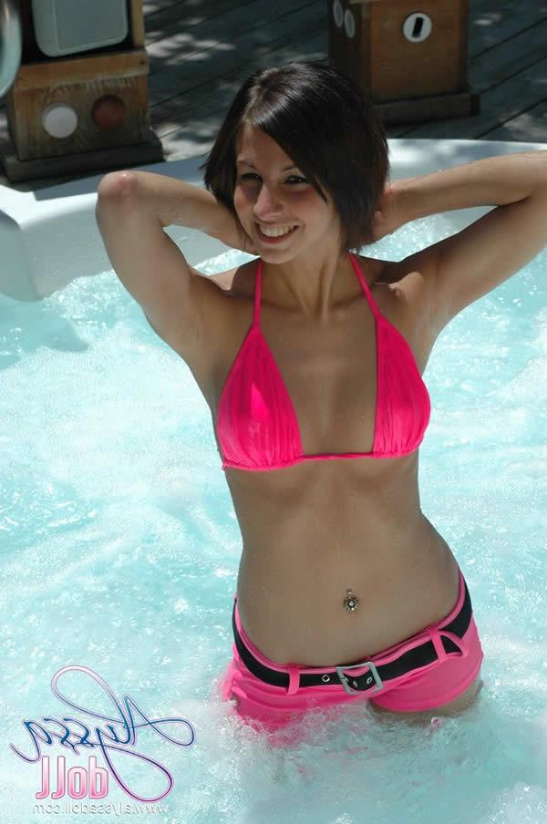 15P Brunette teen splashes and strips in the hottub
