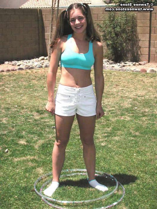 20P Brunette teen plays with a hula hoop