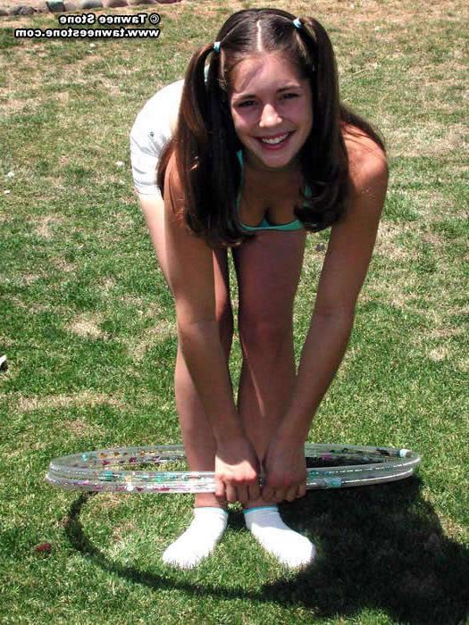 20P Brunette teen plays with a hula hoop