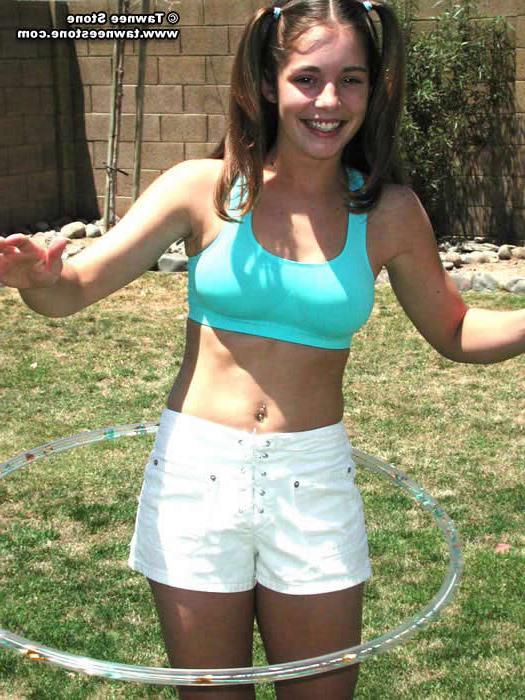20P Brunette teen plays with a hula hoop