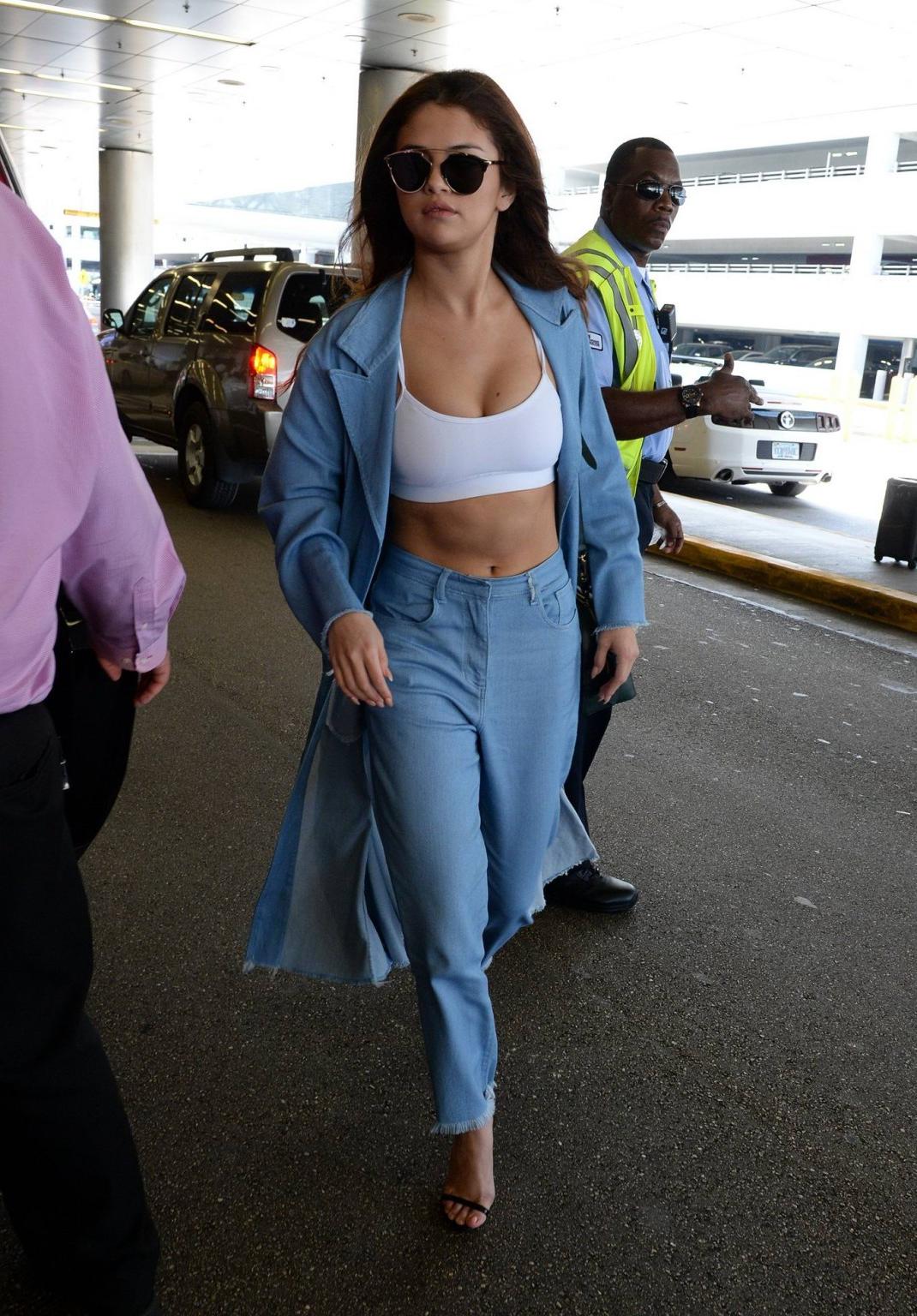 16P Selena Gomez busty in tiny white sports bra outdoor