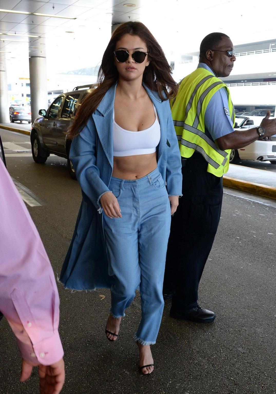 16P Selena Gomez busty in tiny white sports bra outdoor