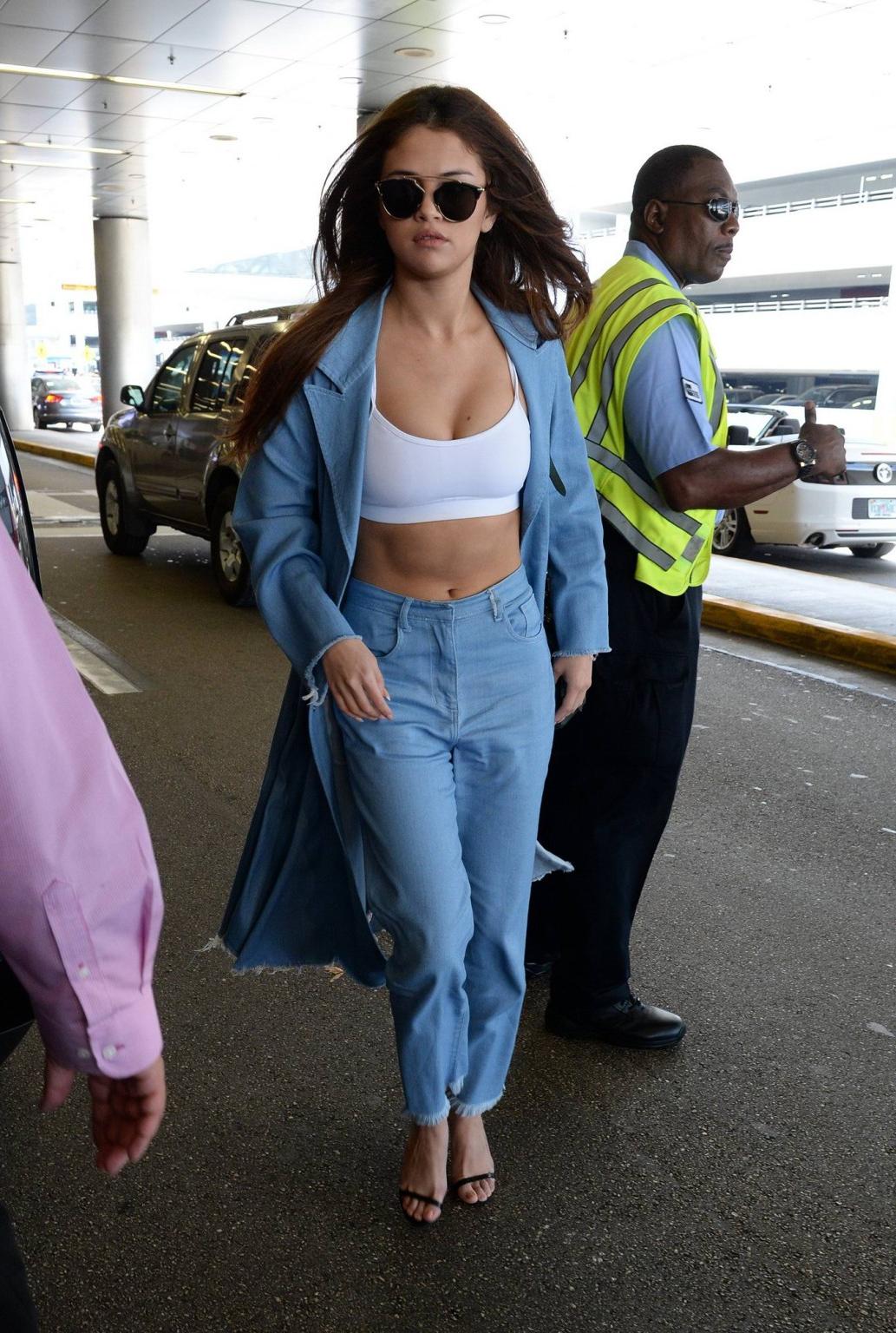 16P Selena Gomez busty in tiny white sports bra outdoor