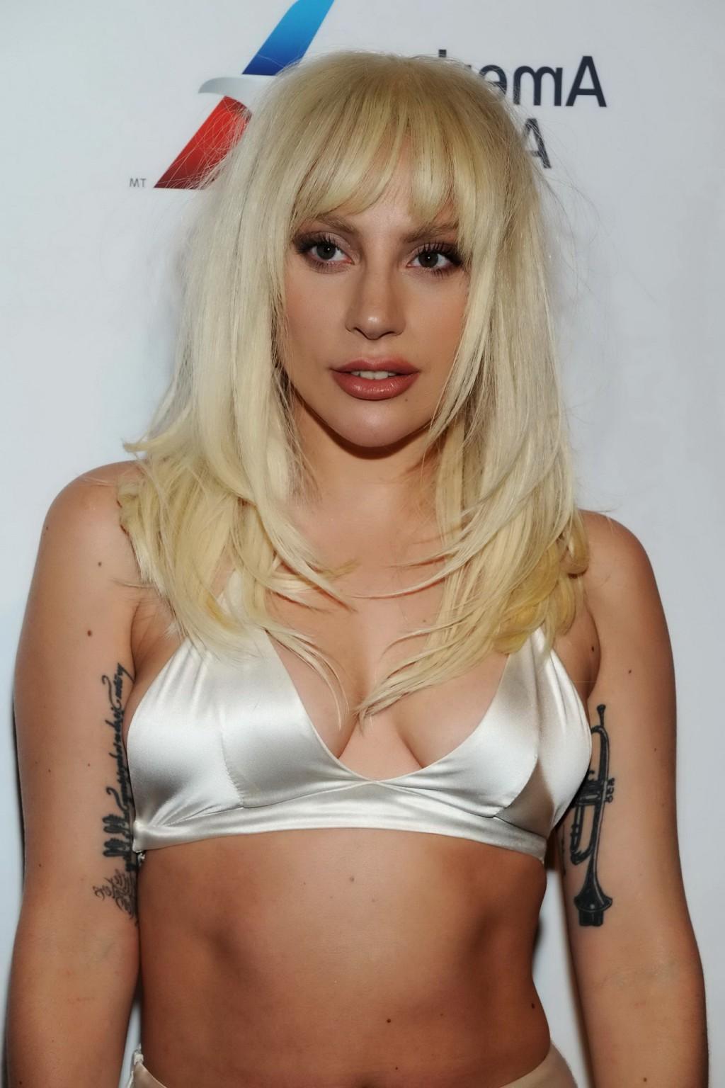 16P Lady Gaga busty in tiny white bra and skirt in public