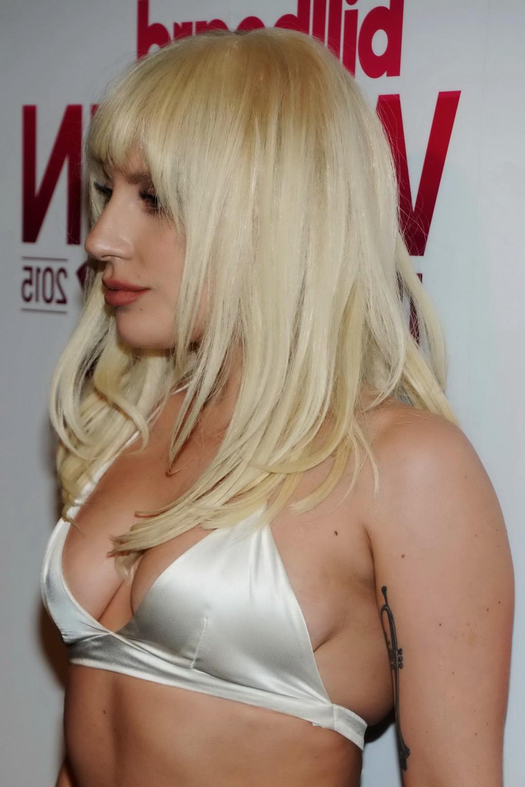 16P Lady Gaga busty in tiny white bra and skirt in public