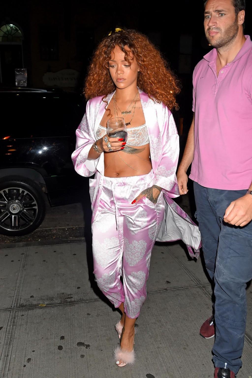 16P Rihanna shows off her boobs in a see through bra out in NYC