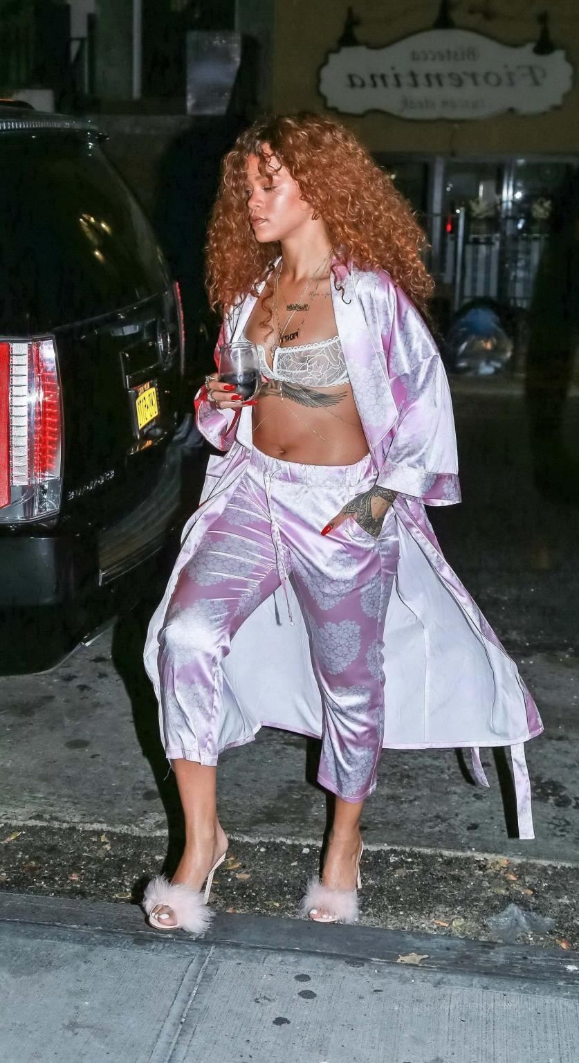 16P Rihanna shows off her boobs in a see through bra out in NYC