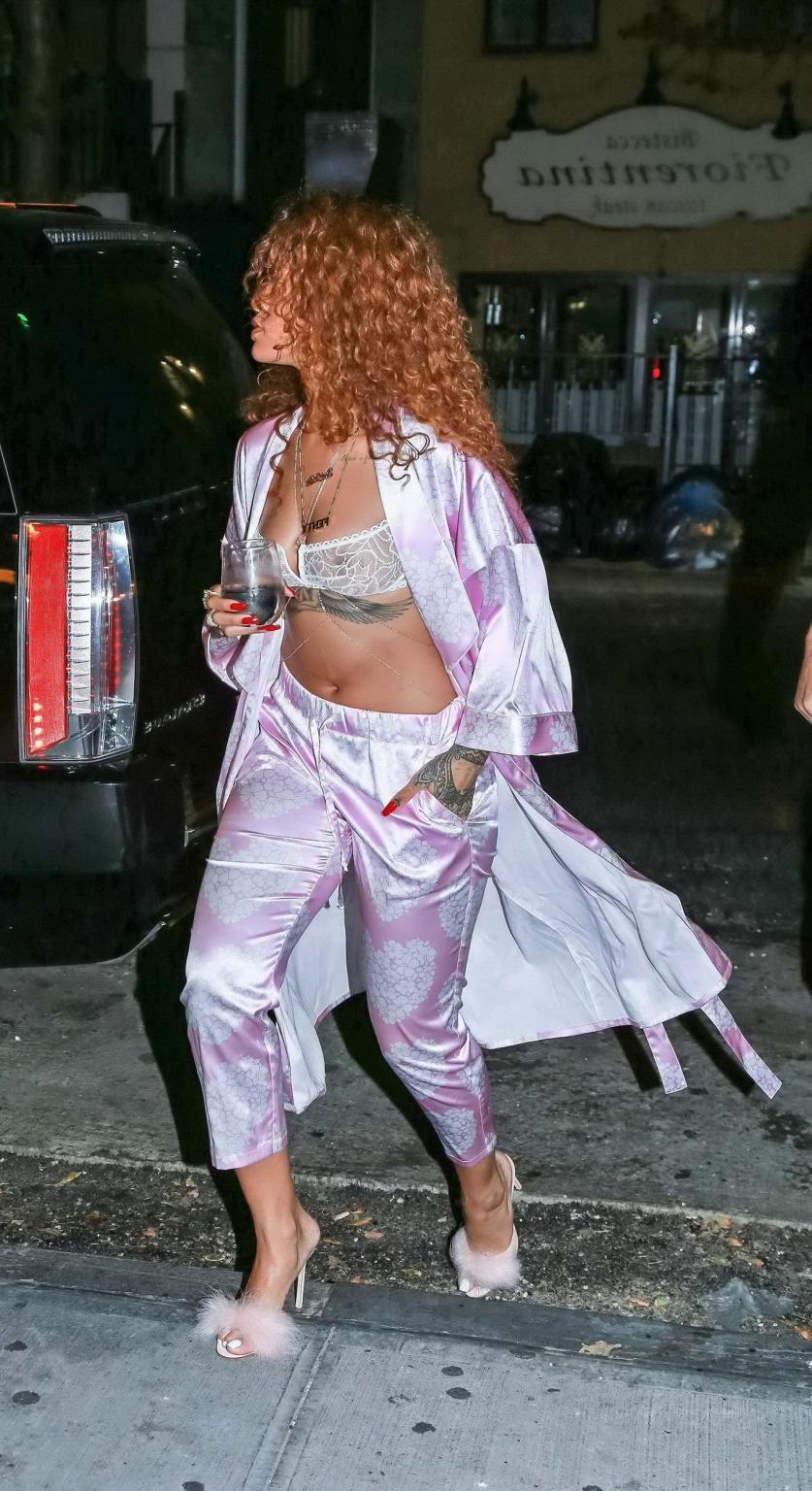 16P Rihanna shows off her boobs in a see through bra out in NYC