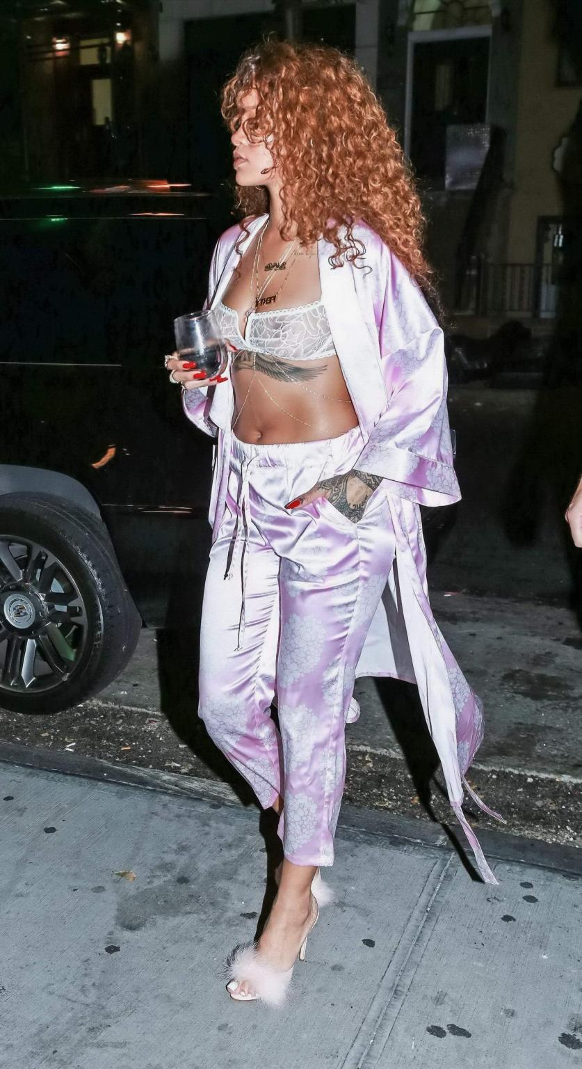 16P Rihanna shows off her boobs in a see through bra out in NYC