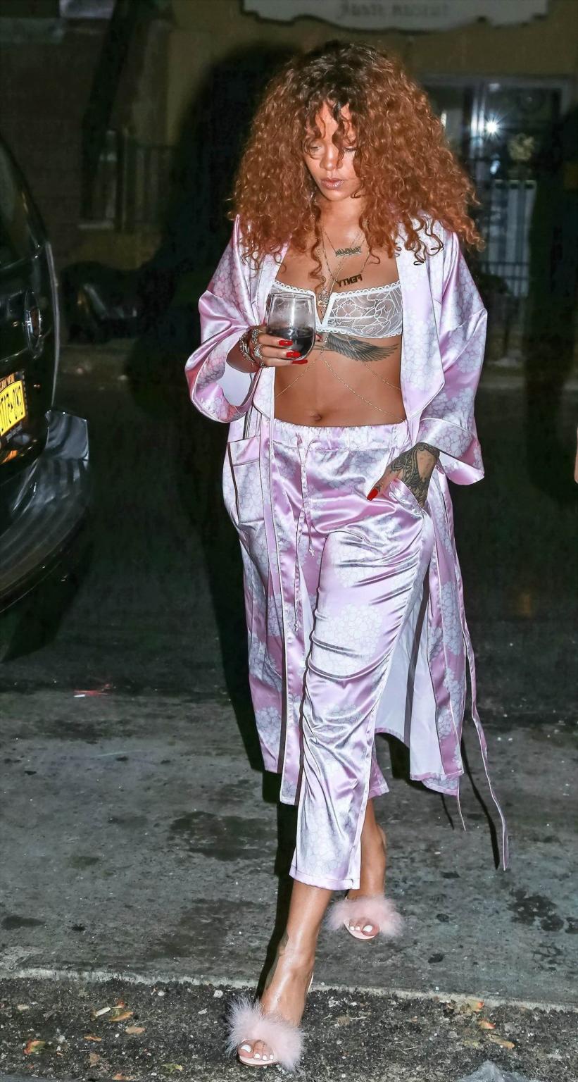 16P Rihanna shows off her boobs in a see through bra out in NYC
