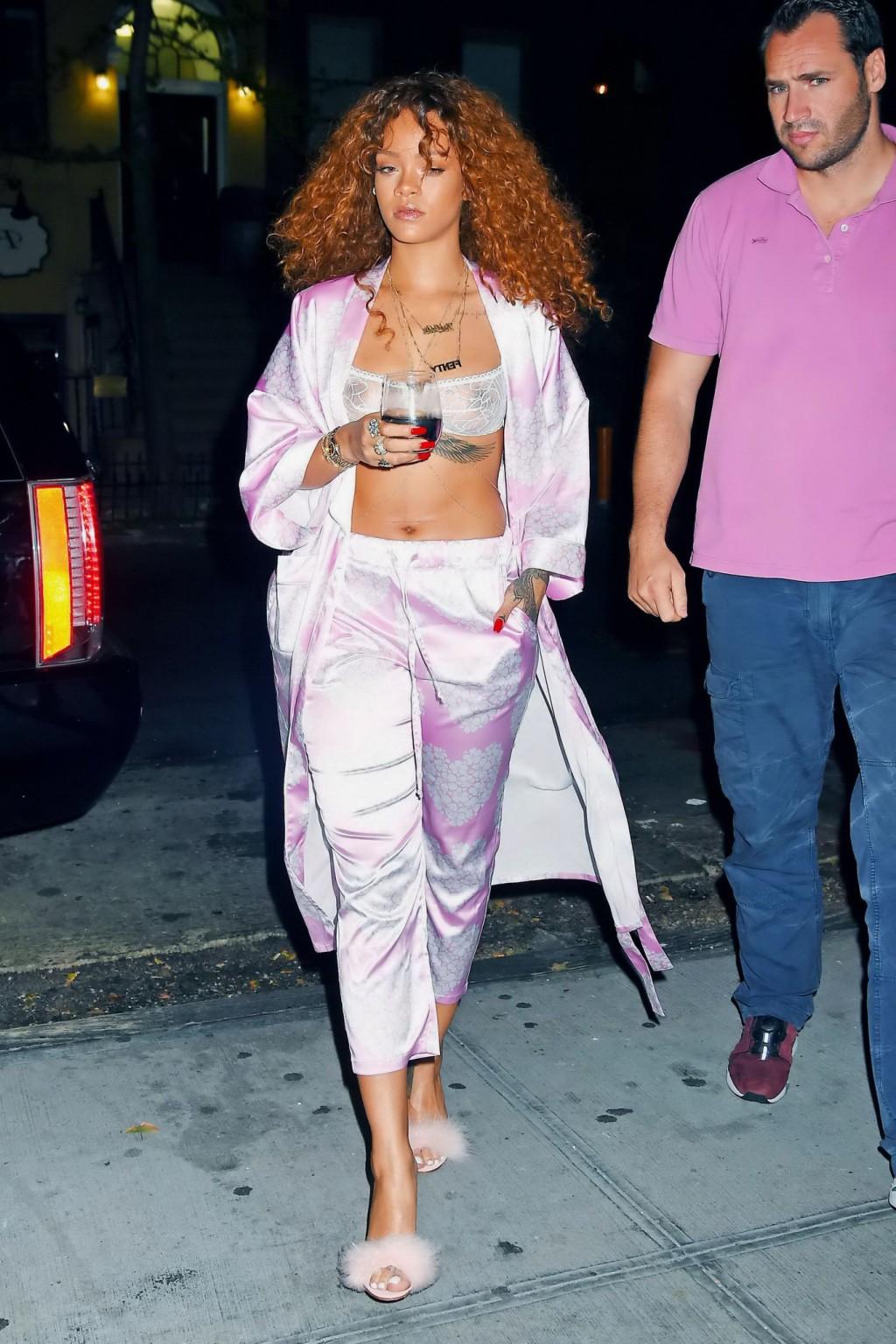 16P Rihanna shows off her boobs in a see through bra out in NYC