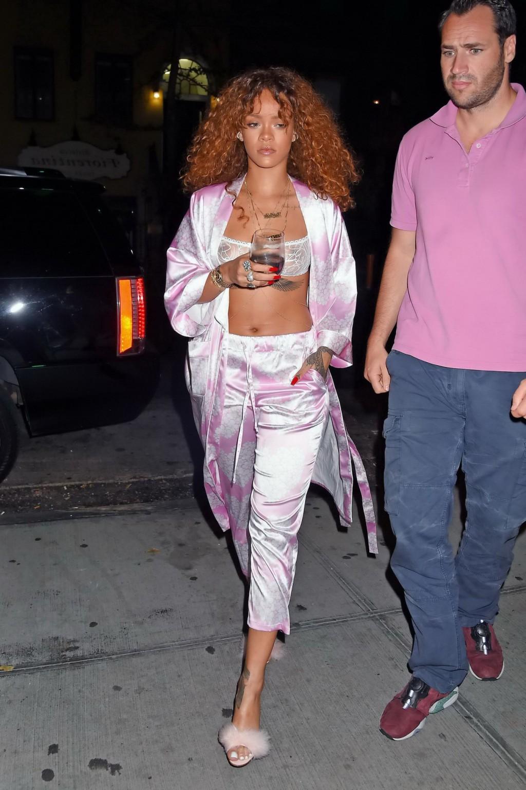16P Rihanna shows off her boobs in a see through bra out in NYC