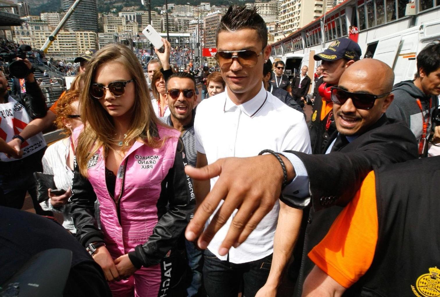 16P Cara Delevingne bra peak wearing an auto racing suit at McLaren Honda pitlane ph