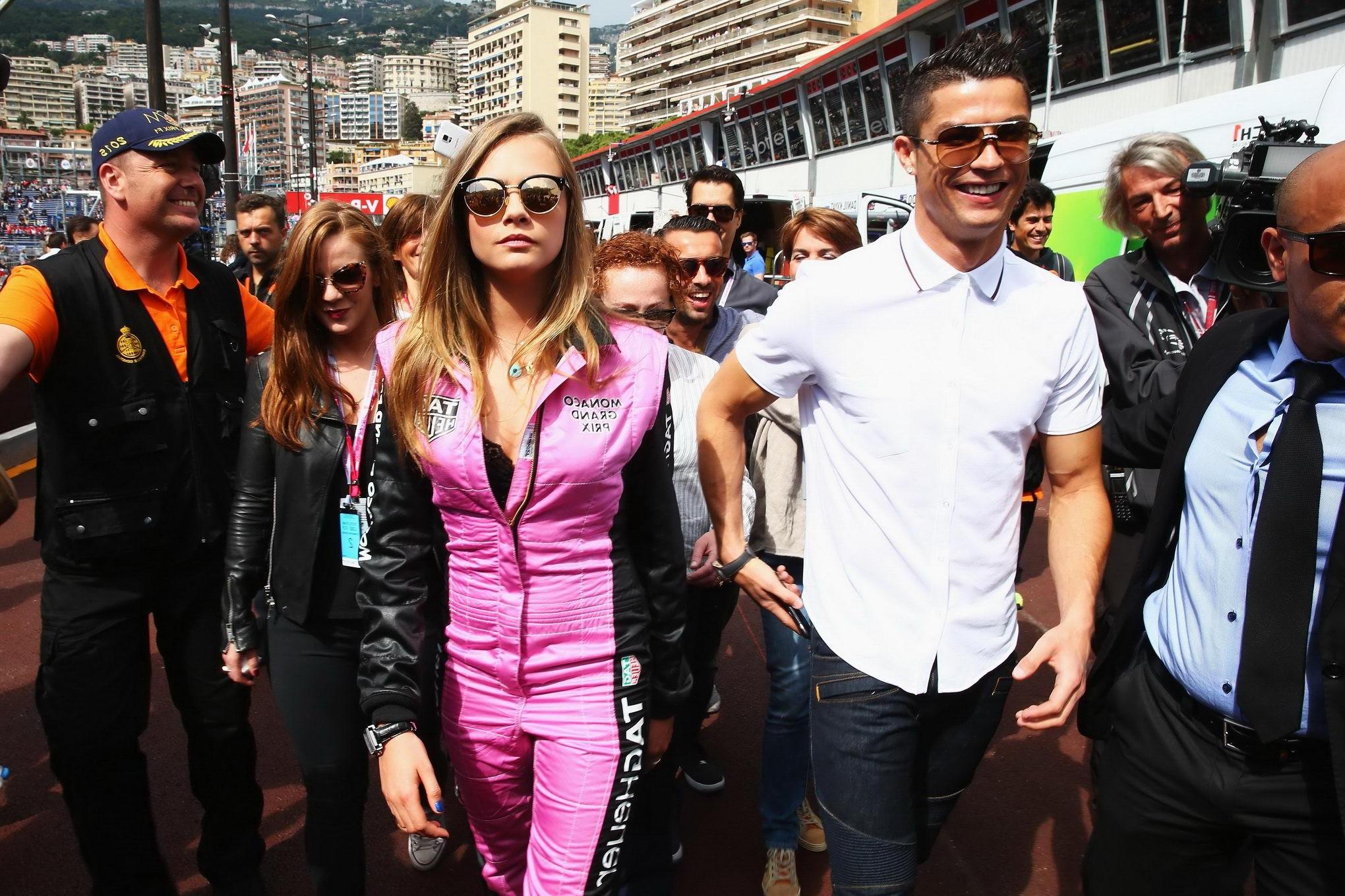 16P Cara Delevingne bra peak wearing an auto racing suit at McLaren Honda pitlane ph