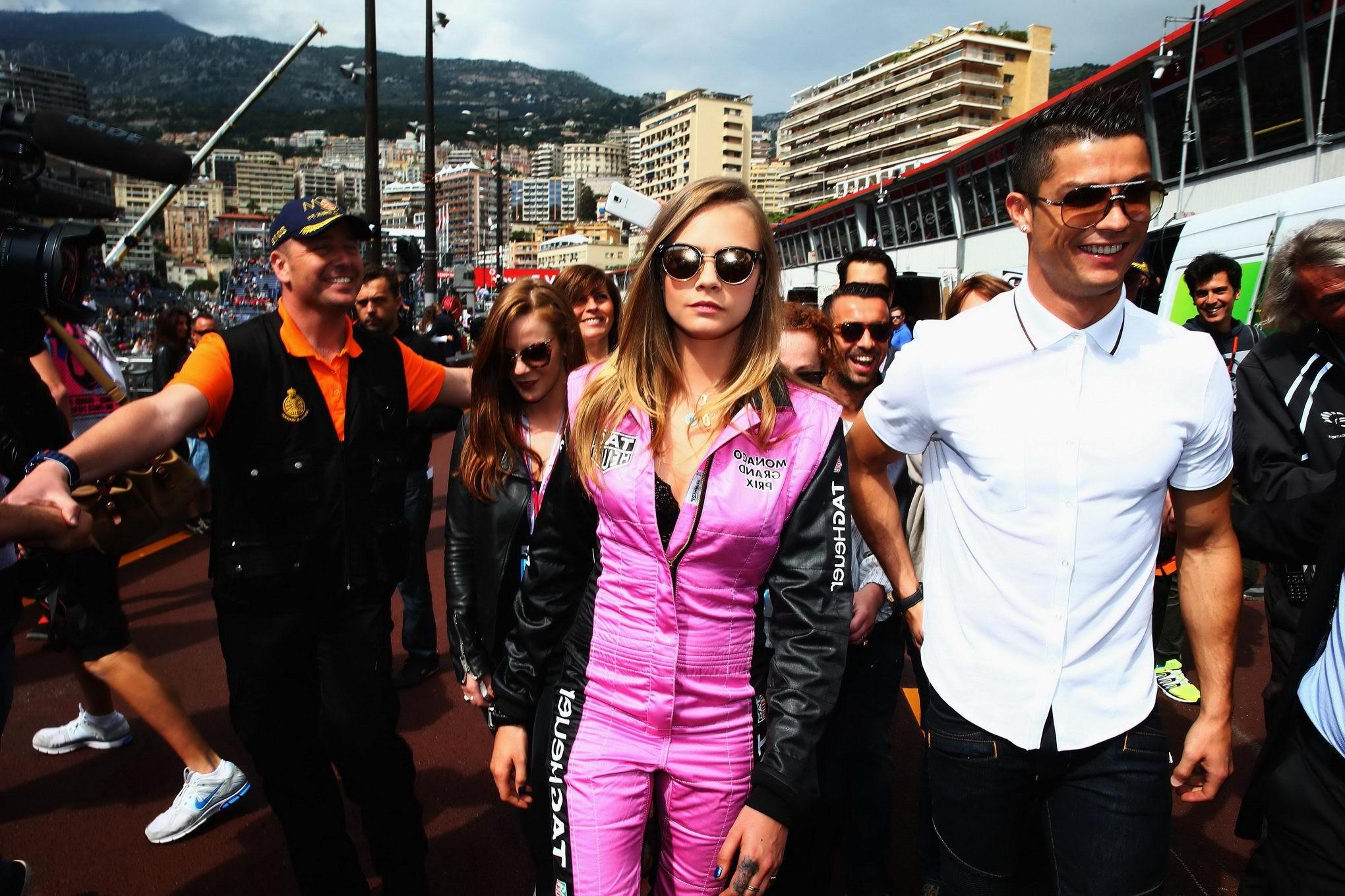 16P Cara Delevingne bra peak wearing an auto racing suit at McLaren Honda pitlane ph