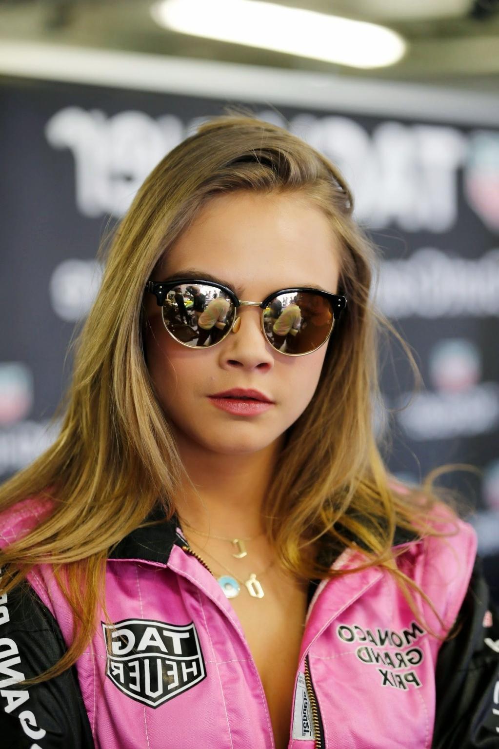 16P Cara Delevingne bra peak wearing an auto racing suit at McLaren Honda pitlane ph