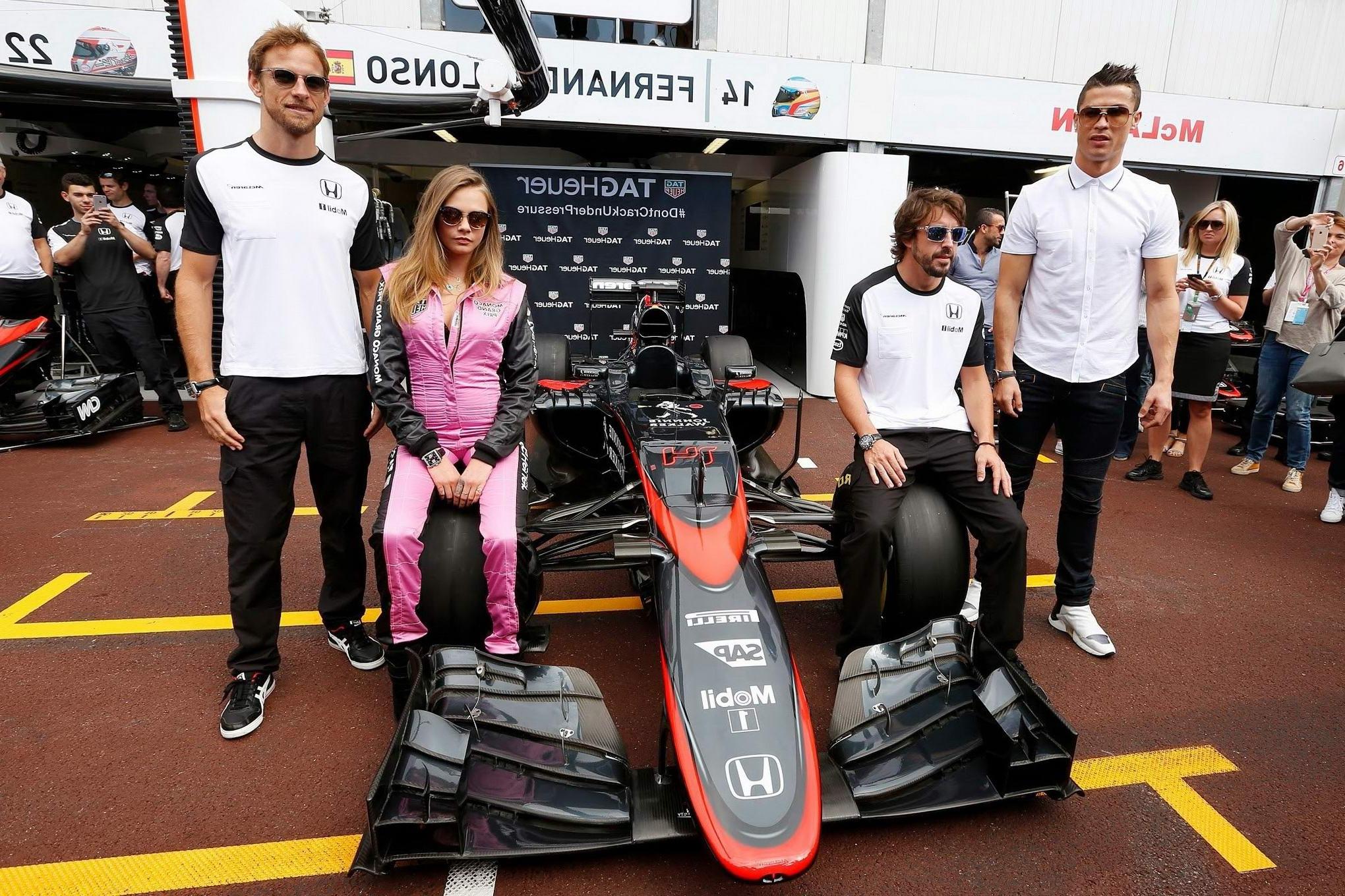 16P Cara Delevingne bra peak wearing an auto racing suit at McLaren Honda pitlane ph
