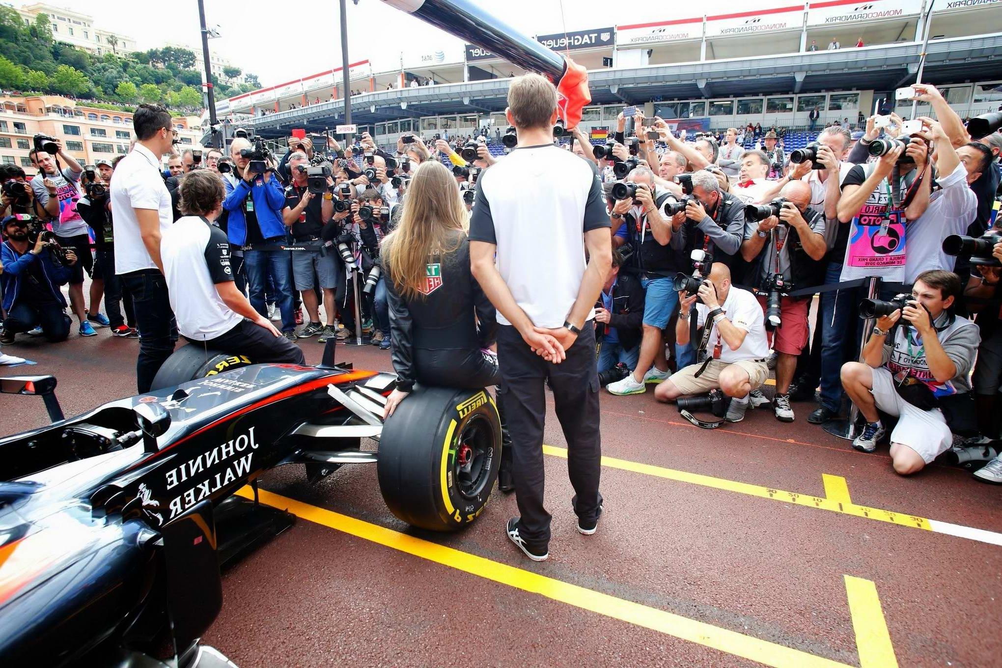 16P Cara Delevingne bra peak wearing an auto racing suit at McLaren Honda pitlane ph
