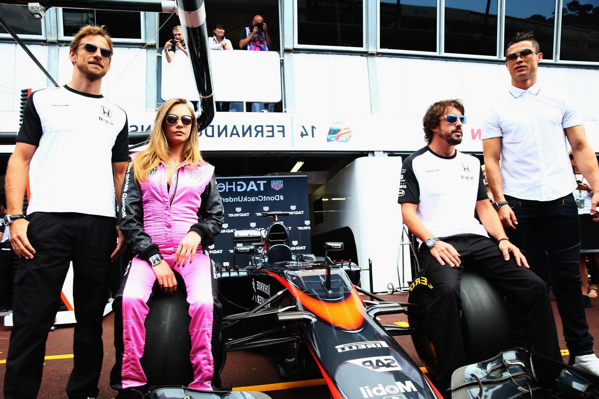 16P Cara Delevingne bra peak wearing an auto racing suit at McLaren Honda pitlane ph