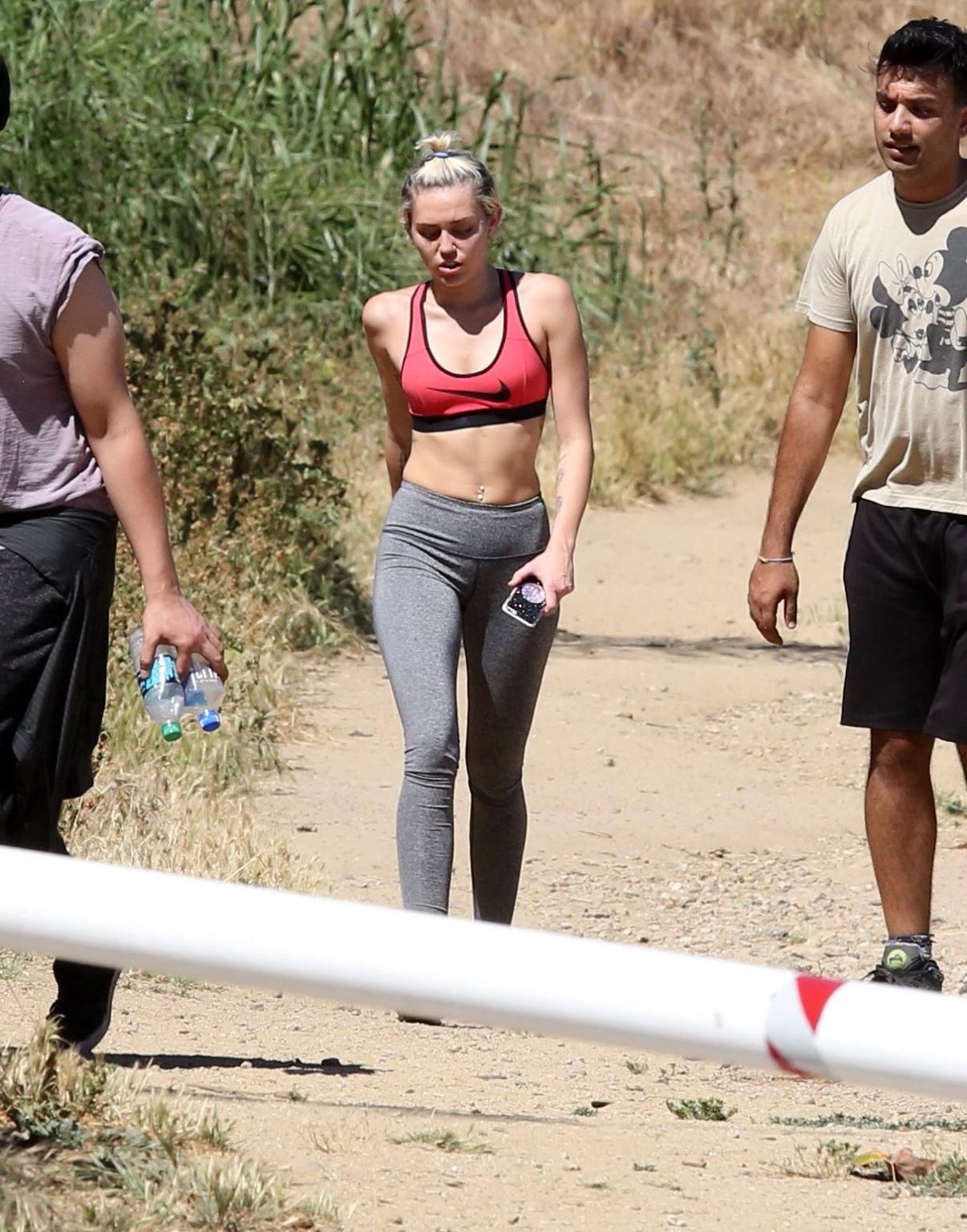 16P Miley Cyrus in sports bra  tights hiking with friends in LA