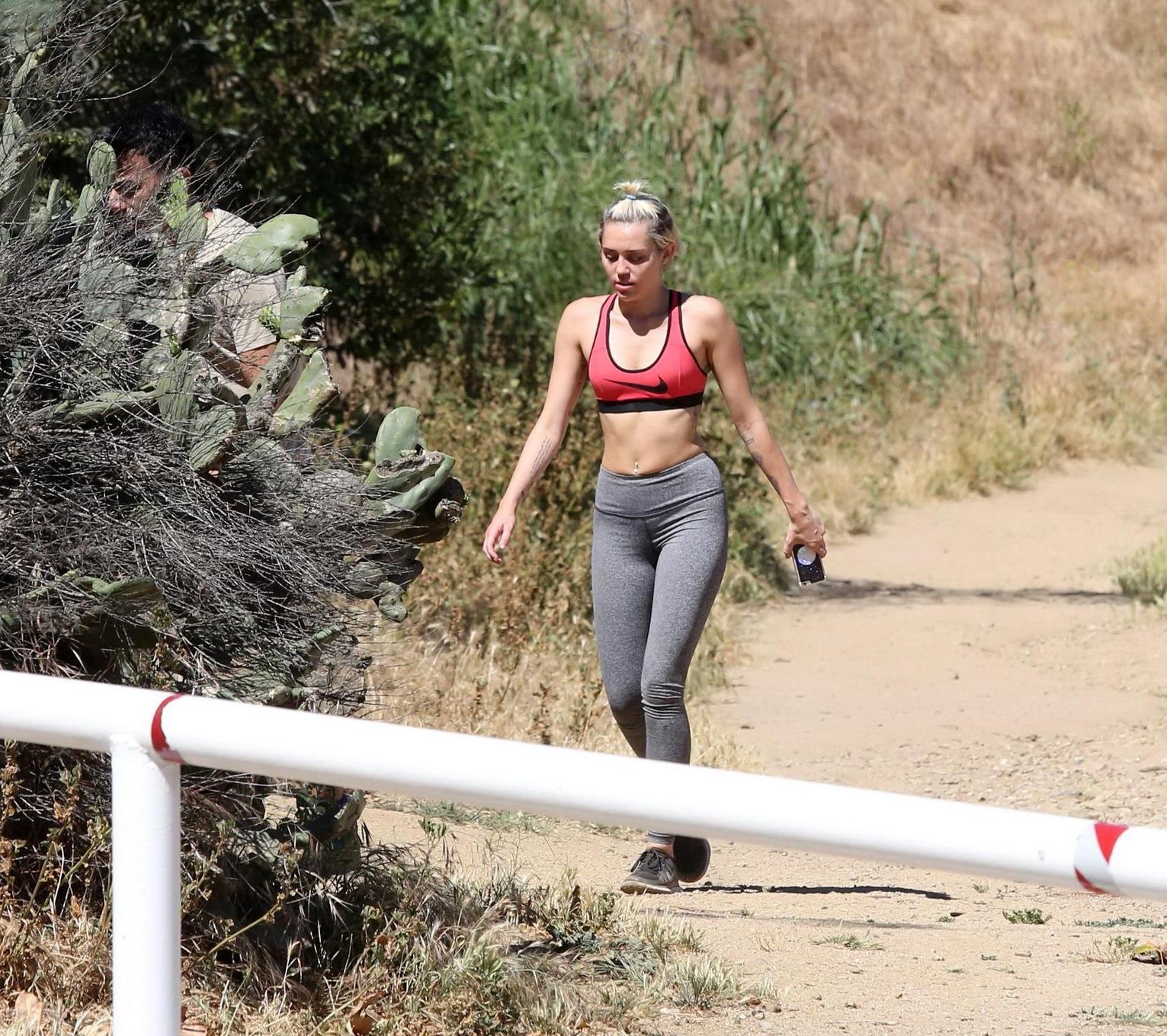 16P Miley Cyrus in sports bra  tights hiking with friends in LA