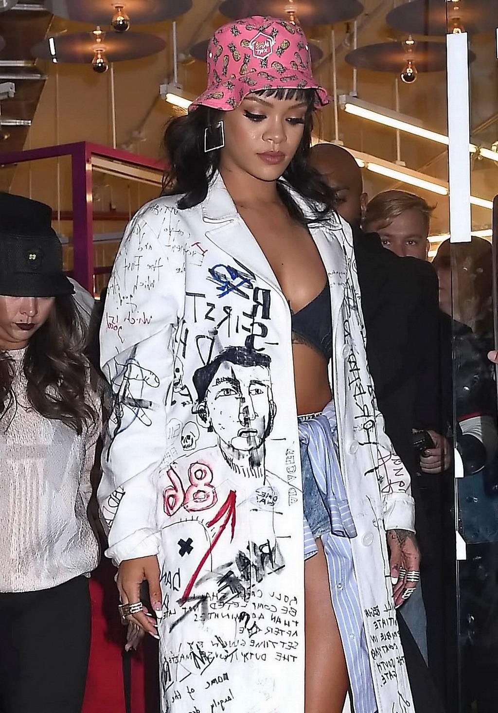 16P Rihanna wearing bra and denim shorts at her fashion line launch in NYC