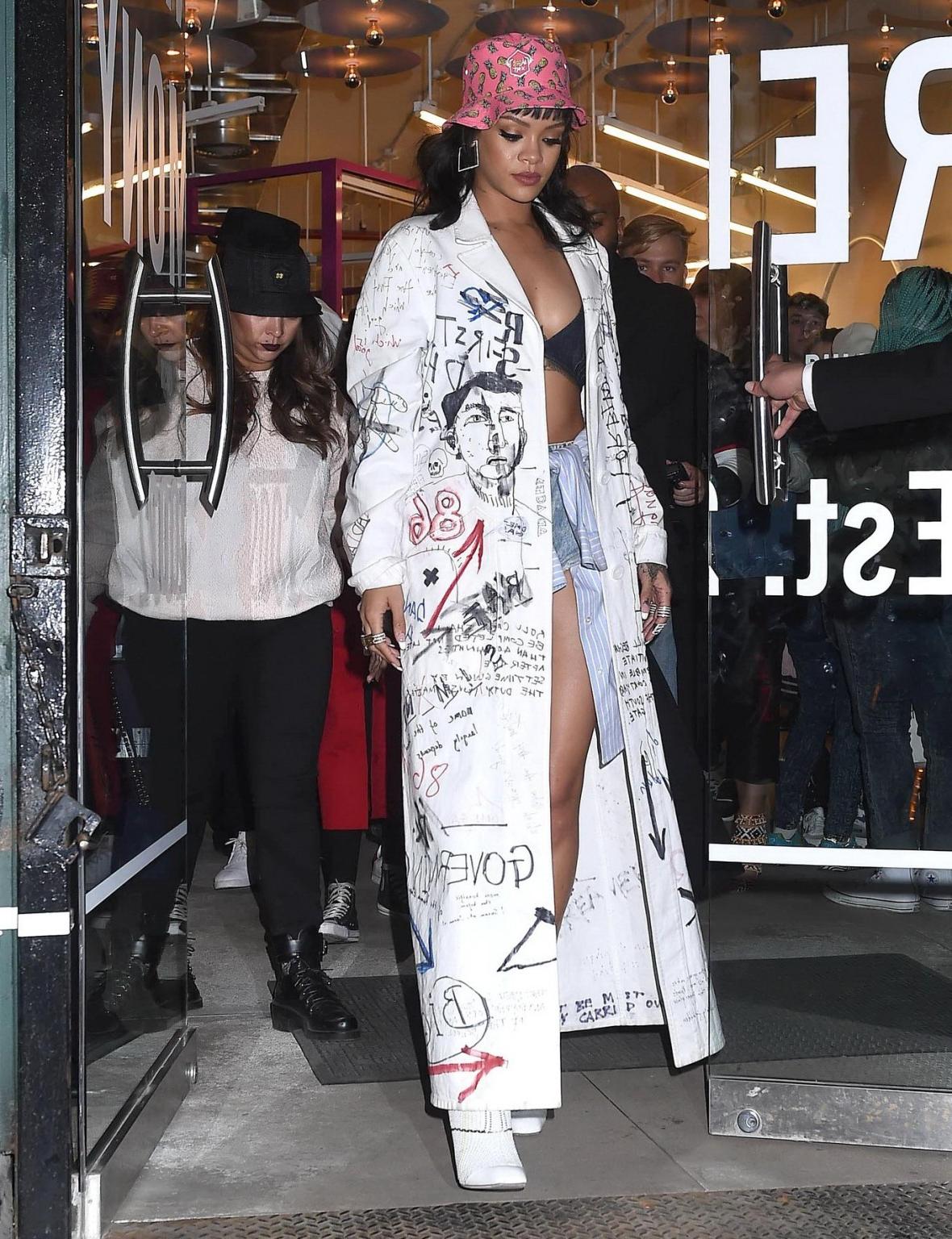 16P Rihanna wearing bra and denim shorts at her fashion line launch in NYC
