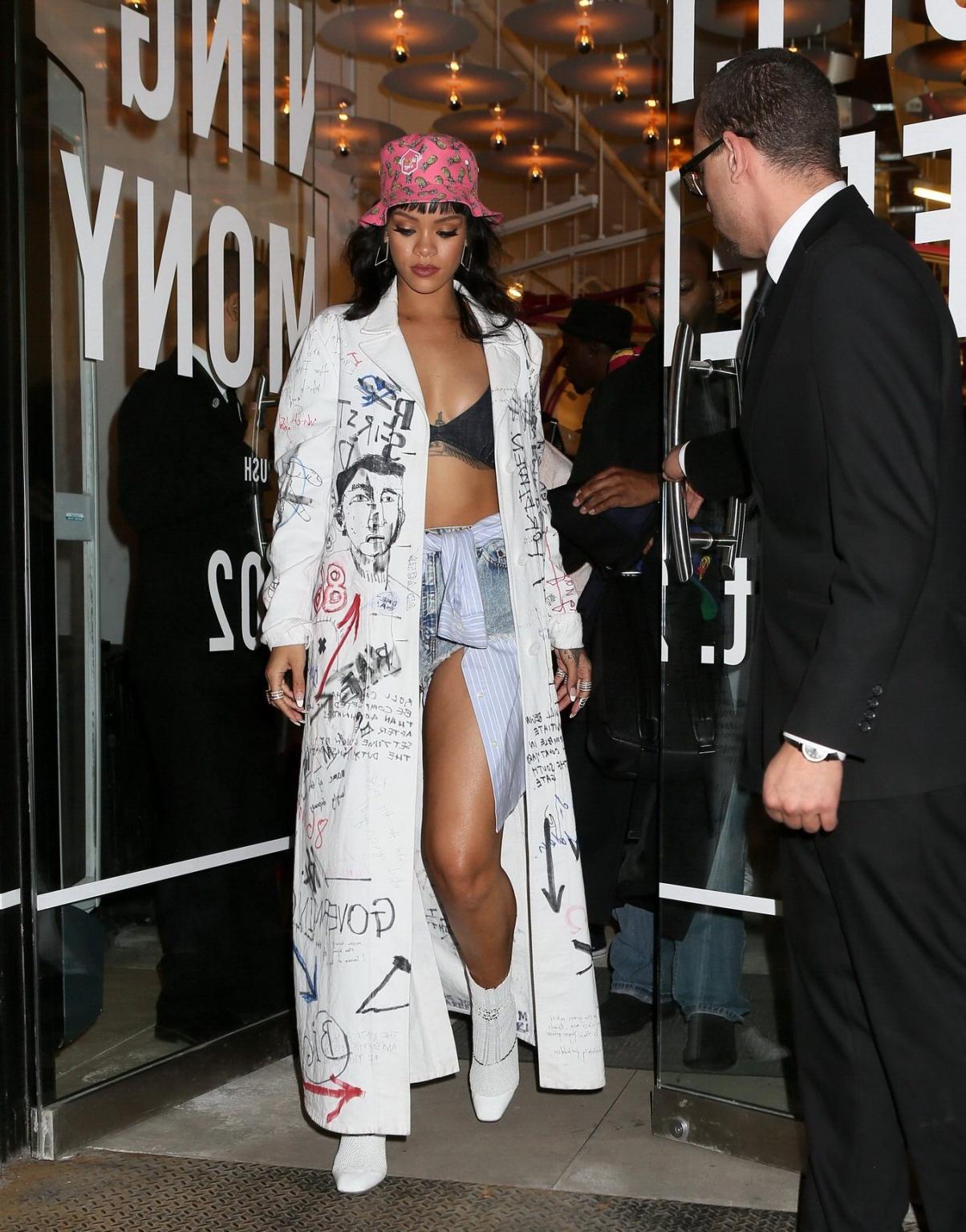 16P Rihanna wearing bra and denim shorts at her fashion line launch in NYC