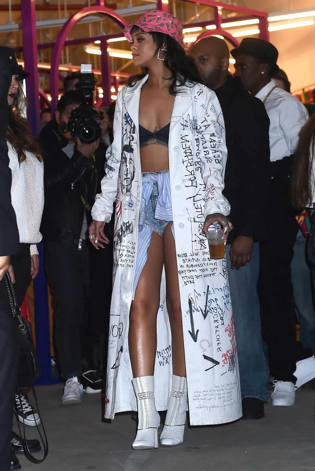 16P Rihanna wearing bra and denim shorts at her fashion line launch in NYC