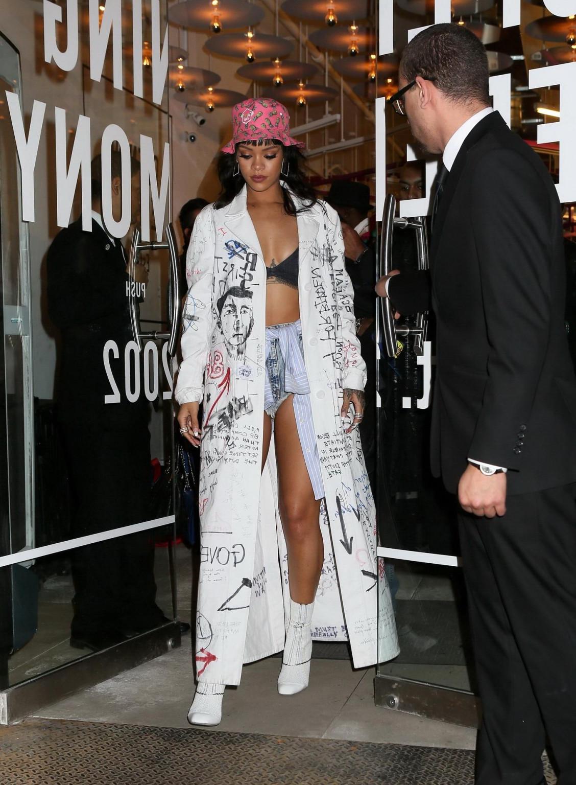 16P Rihanna wearing bra and denim shorts at her fashion line launch in NYC