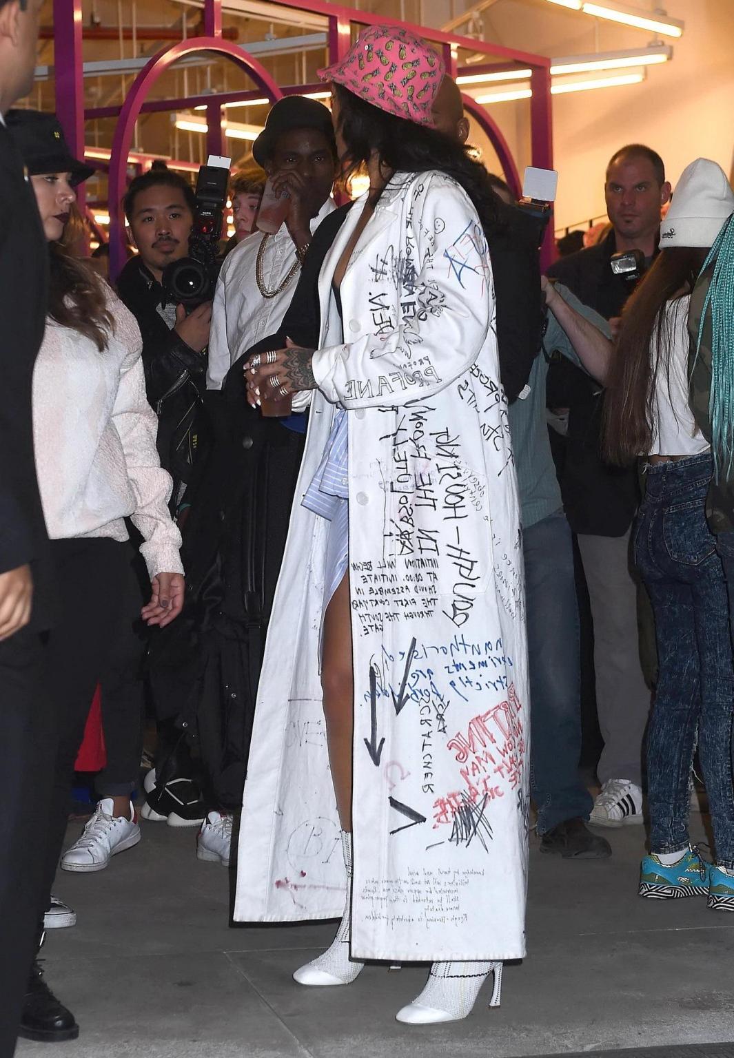 16P Rihanna wearing bra and denim shorts at her fashion line launch in NYC