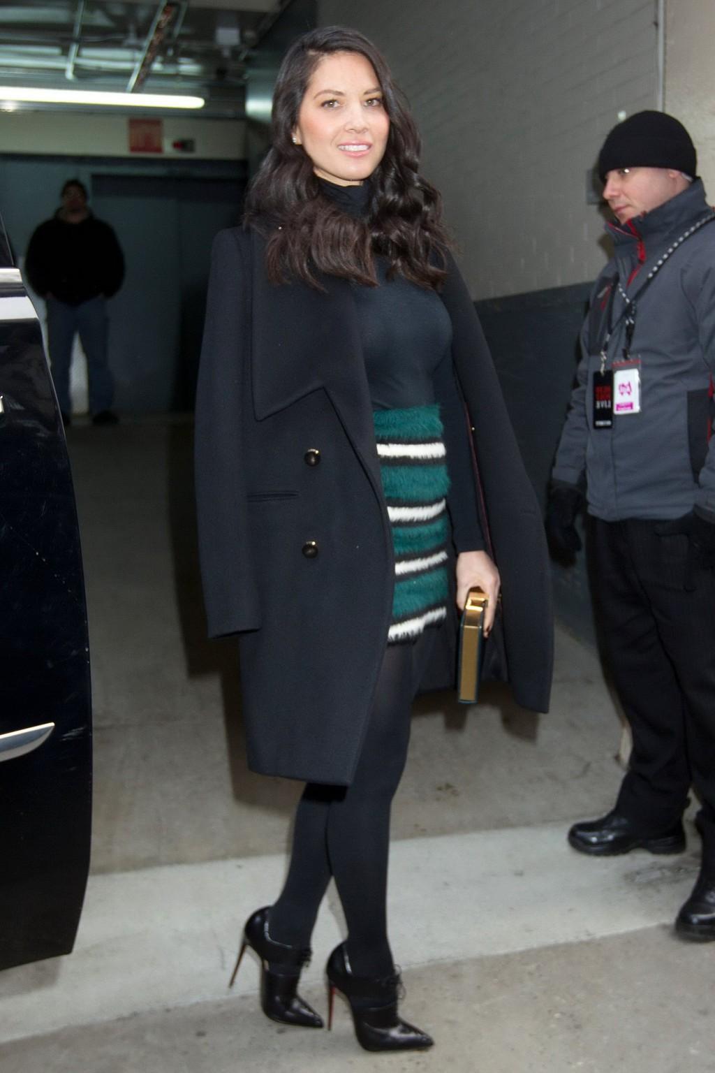 16P Olivia Munn seethru to bra and leggy in mini skirt and pantyhose at AOLs BUILD S