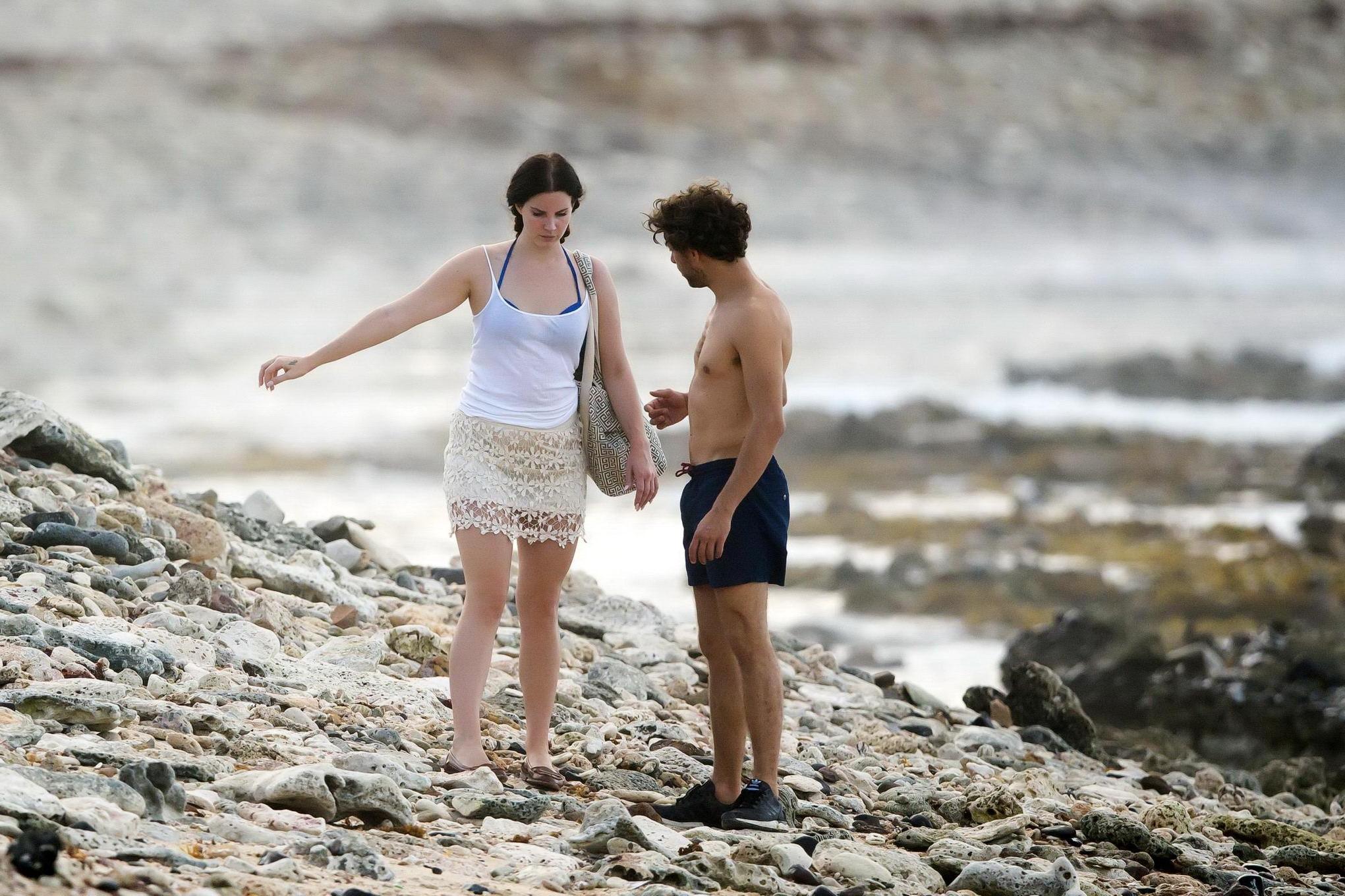 16P Lana Del Rey wearing blue bikini under the cthru skirt  top on a beach in St Bar