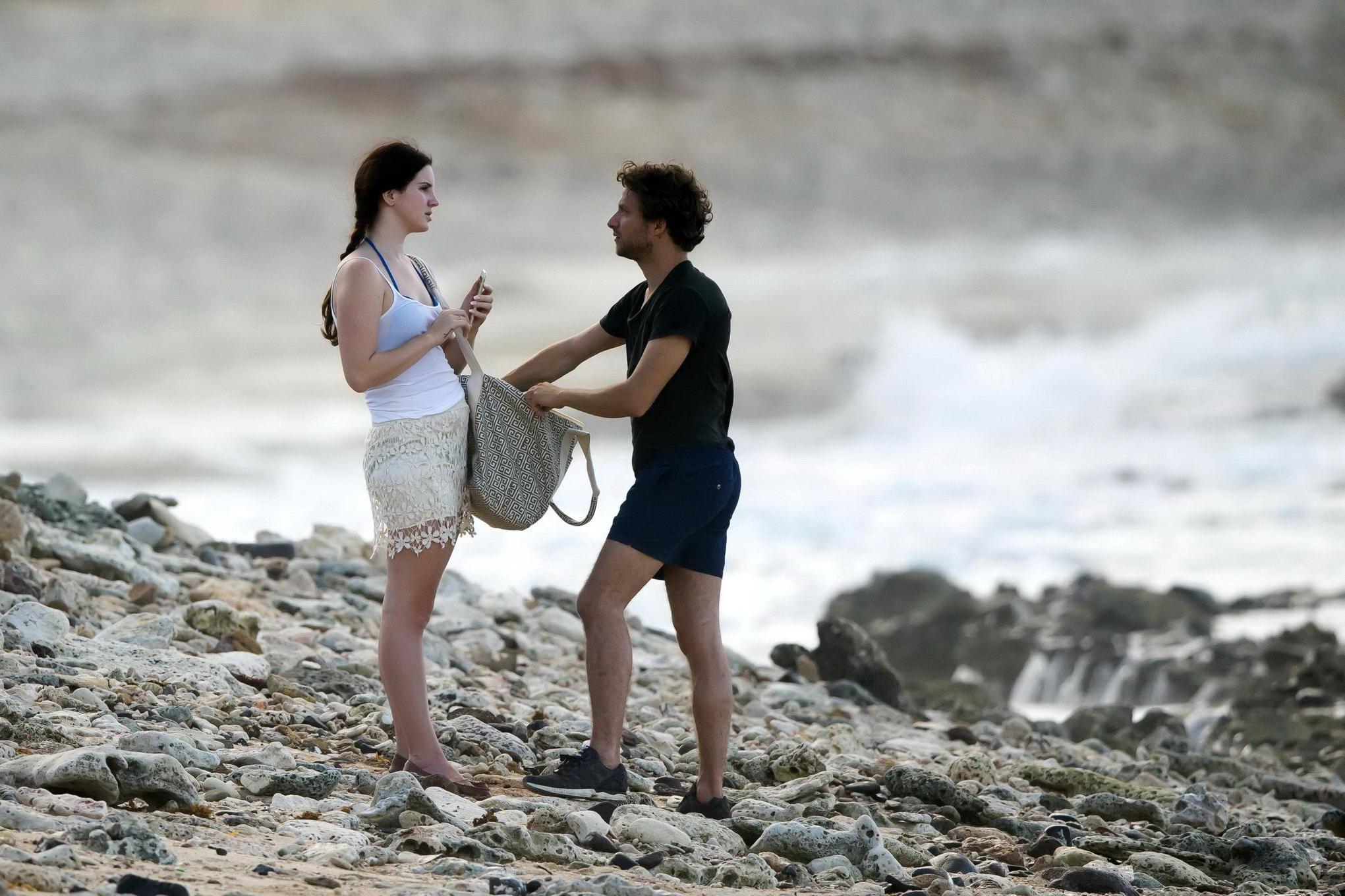 16P Lana Del Rey wearing blue bikini under the cthru skirt  top on a beach in St Bar