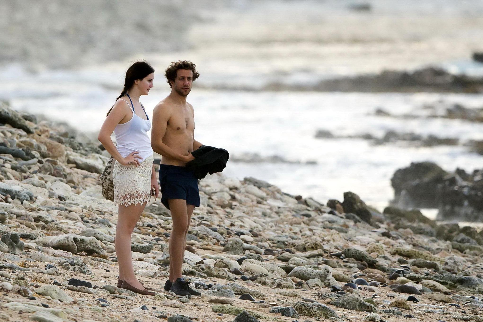 16P Lana Del Rey wearing blue bikini under the cthru skirt  top on a beach in St Bar