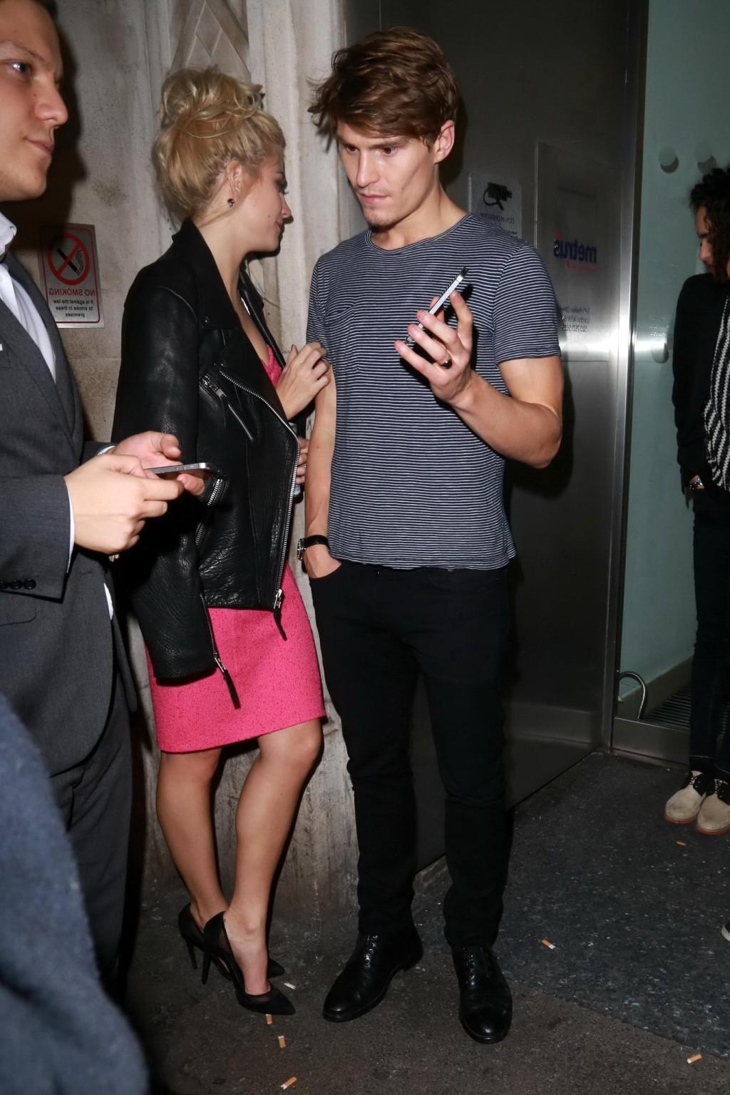 16P Pixie Lott shows huge cleavage leaving the Freedom Bar in Soho London