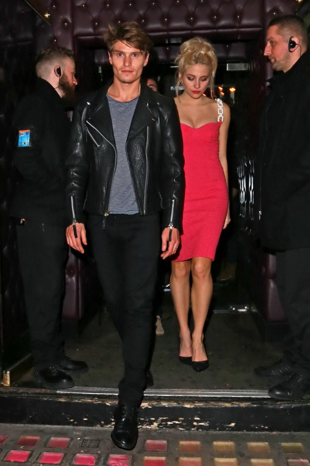 16P Pixie Lott shows huge cleavage leaving the Freedom Bar in Soho London