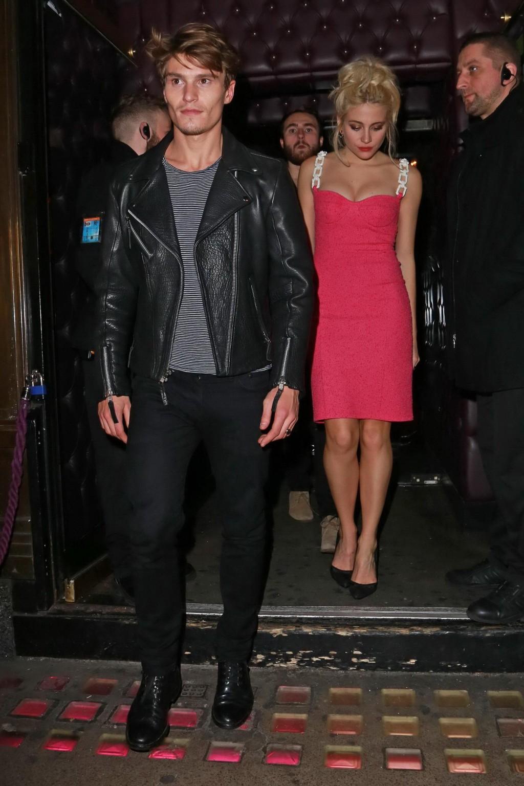 16P Pixie Lott shows huge cleavage leaving the Freedom Bar in Soho London