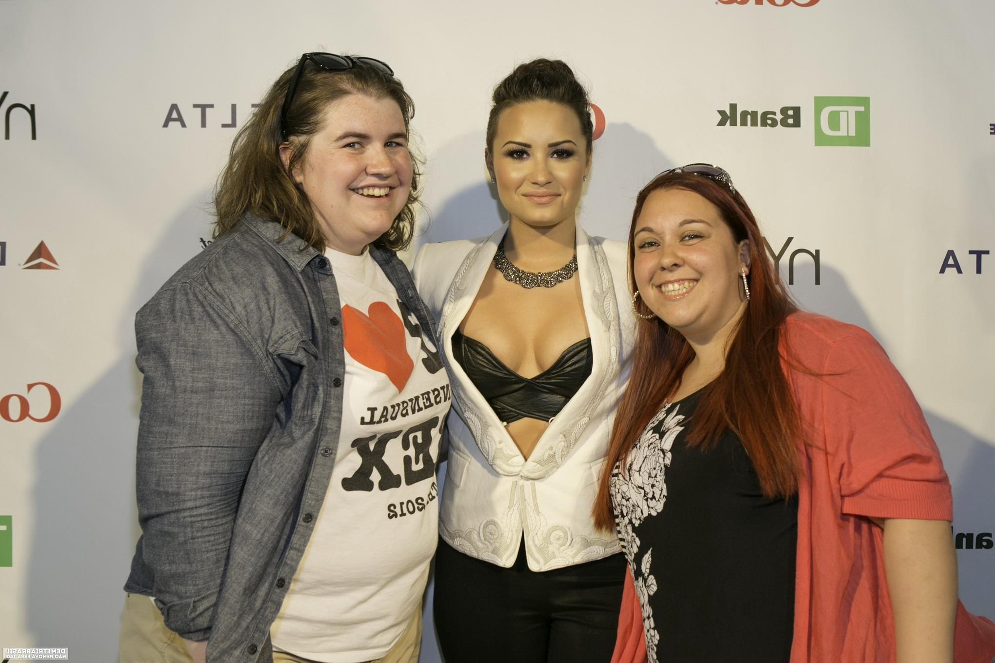 16P Demi Lovato shows off her huge boobs in black leather bra with her funs at NYC P