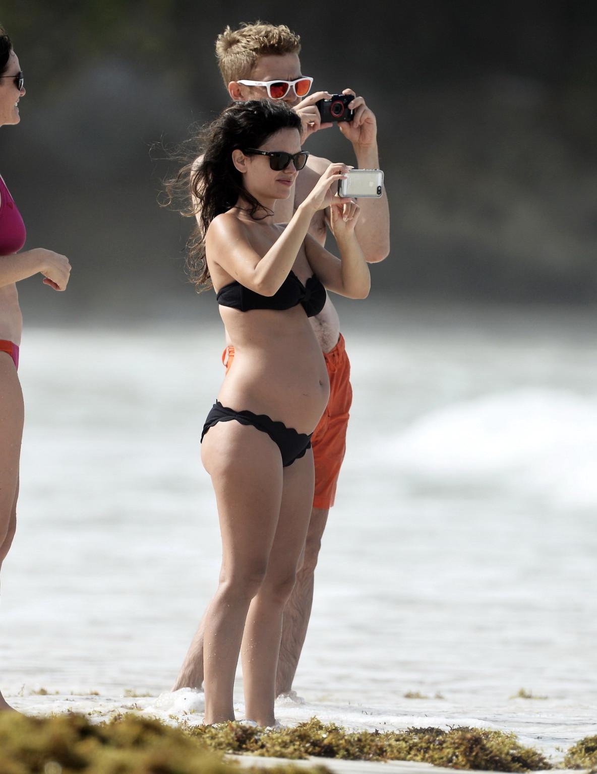 16P Rachel Bilson pregnant wearing a strapless black bikini on a beach in Barbados