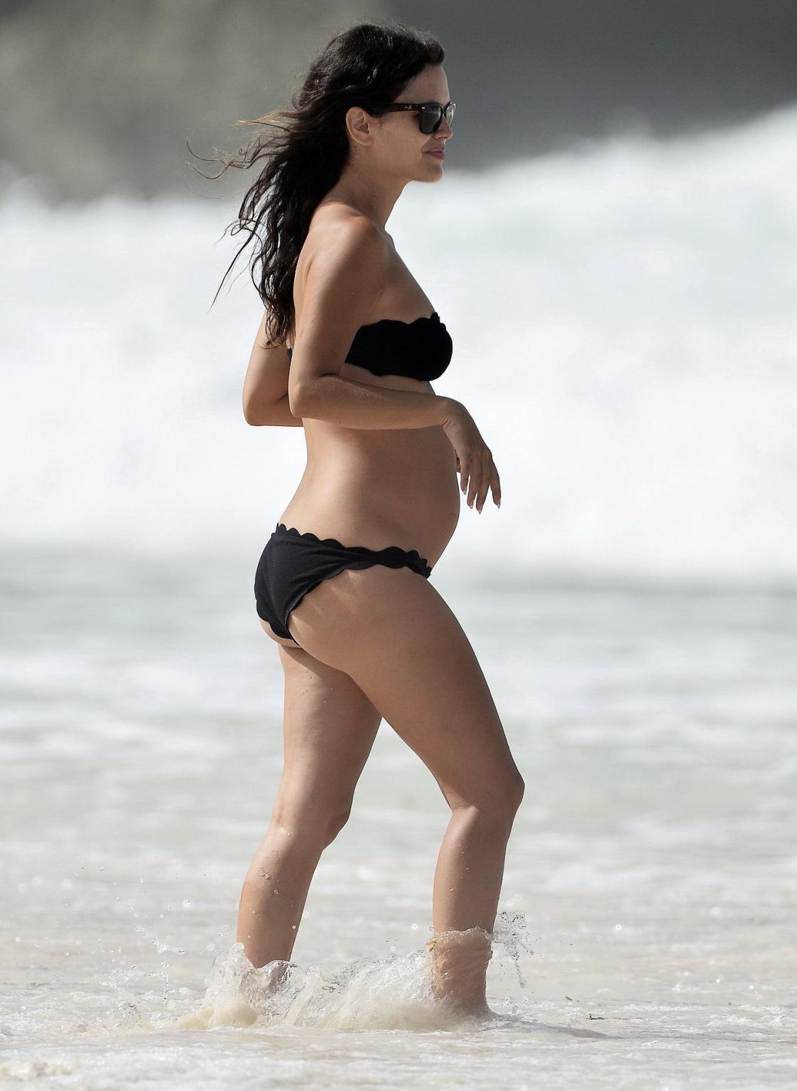 16P Rachel Bilson pregnant wearing a strapless black bikini on a beach in Barbados
