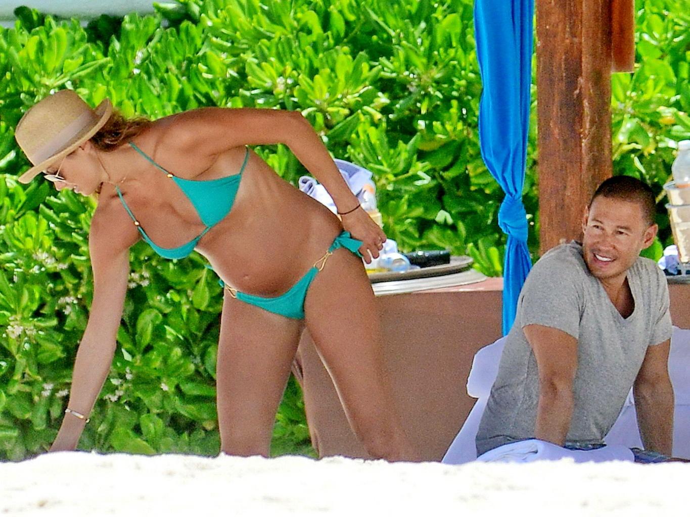 16P Stacy Keibler pregnant wearing a turquoise bikini in Mexico
