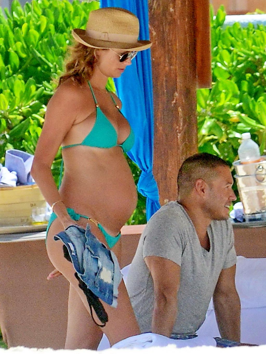 16P Stacy Keibler pregnant wearing a turquoise bikini in Mexico
