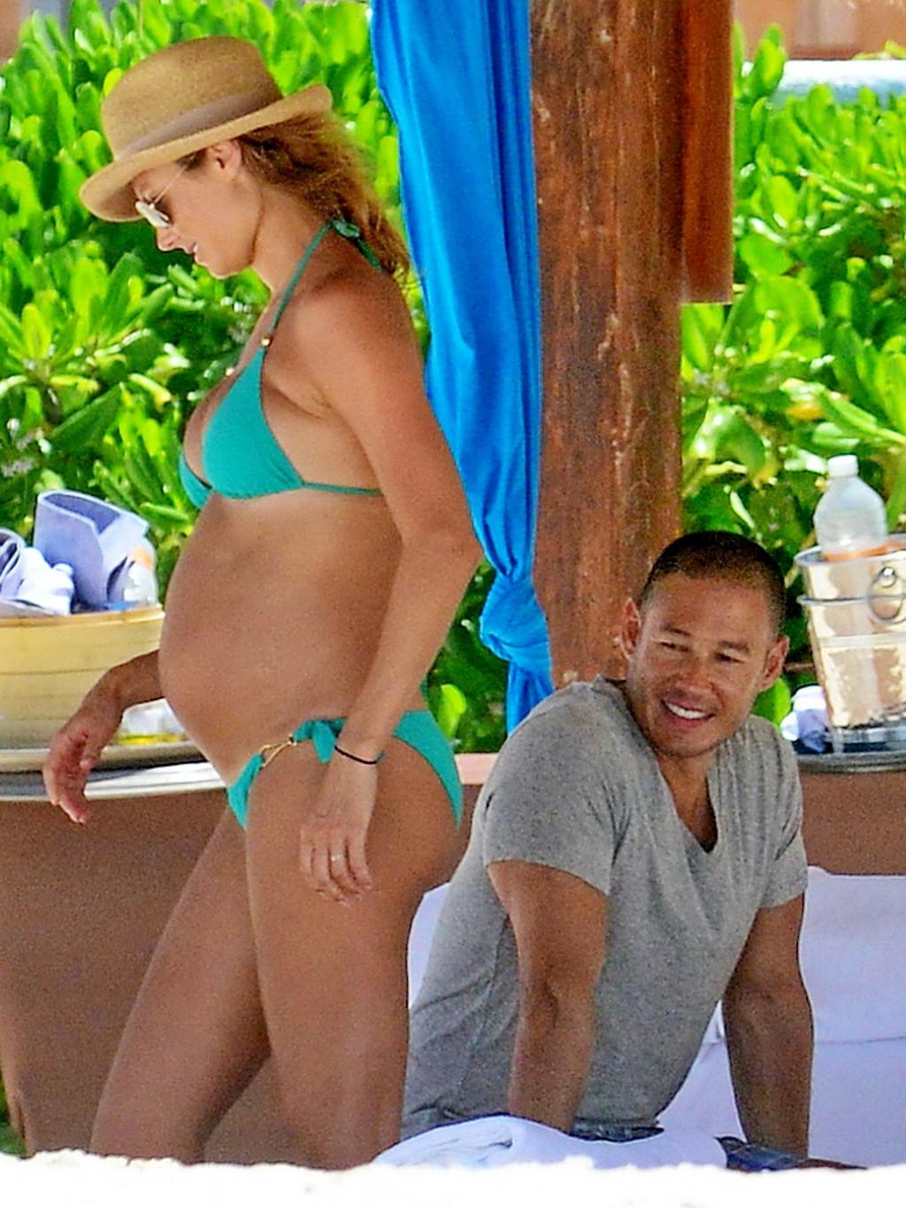 16P Stacy Keibler pregnant wearing a turquoise bikini in Mexico