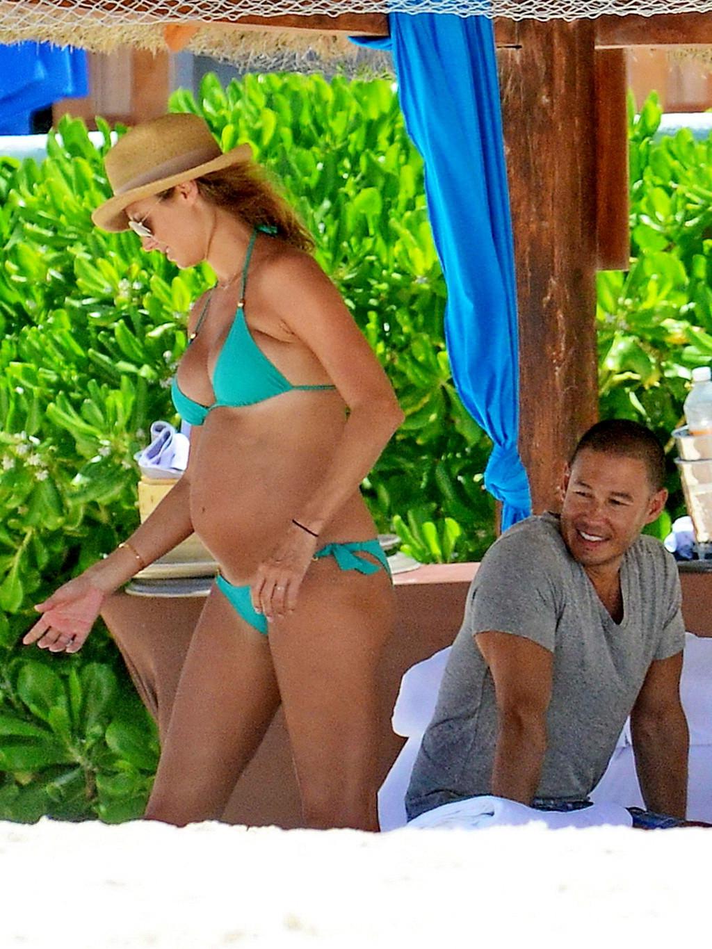 16P Stacy Keibler pregnant wearing a turquoise bikini in Mexico