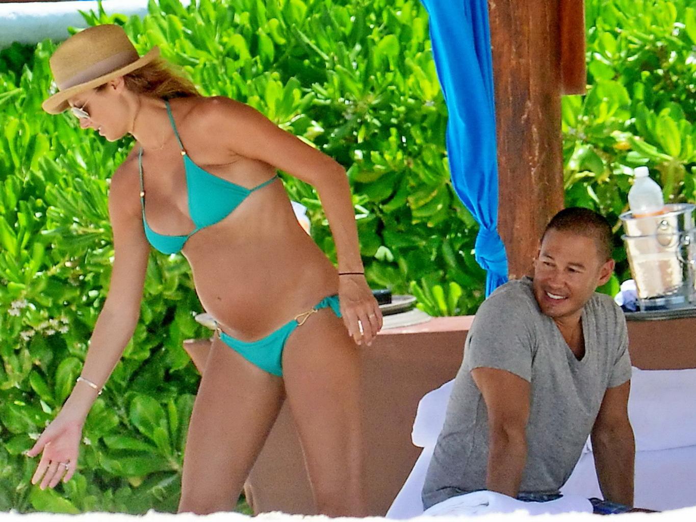 16P Stacy Keibler pregnant wearing a turquoise bikini in Mexico