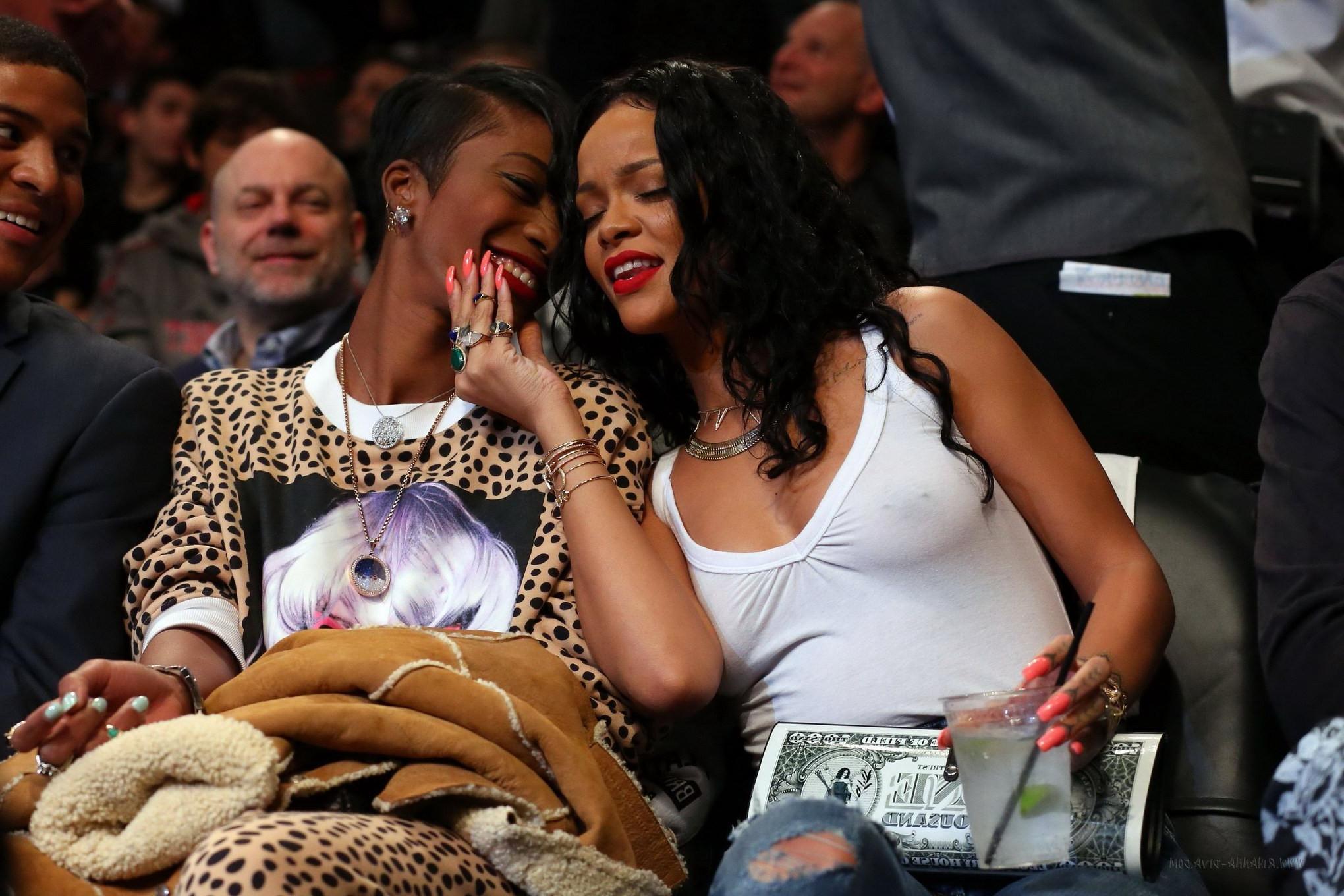 16P Rihanna shows off her boobs in seethru top at a basketball game in NYC