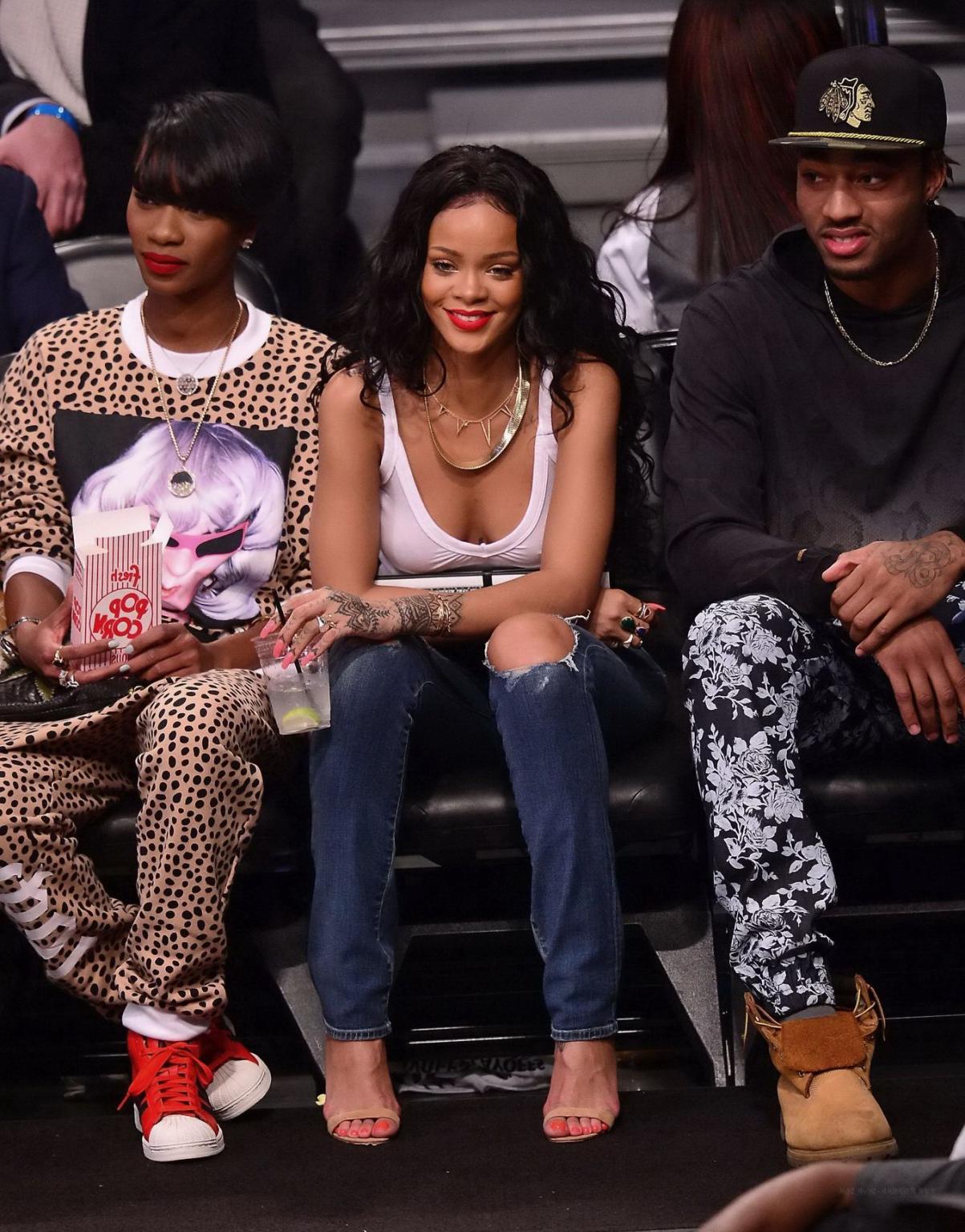 16P Rihanna shows off her boobs in seethru top at a basketball game in NYC