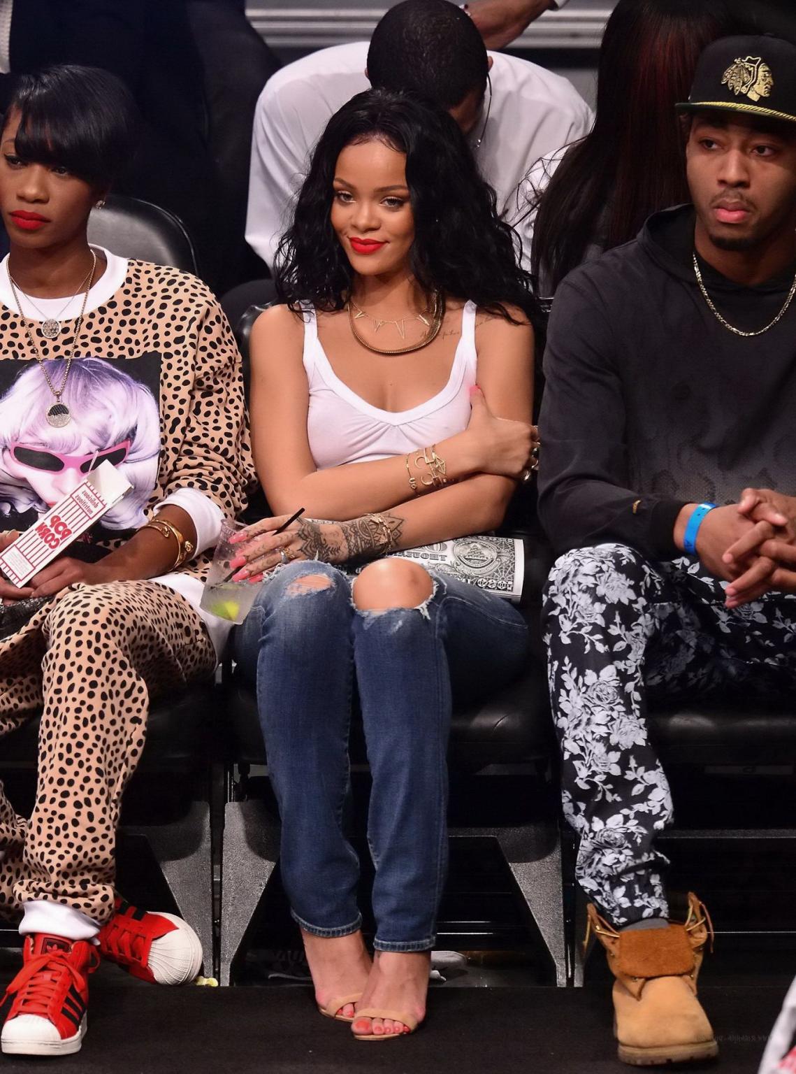 16P Rihanna shows off her boobs in seethru top at a basketball game in NYC