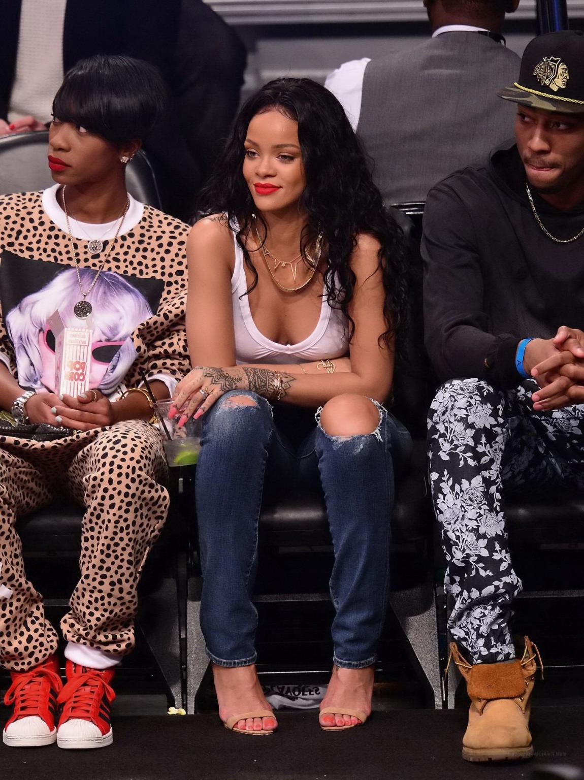 16P Rihanna shows off her boobs in seethru top at a basketball game in NYC